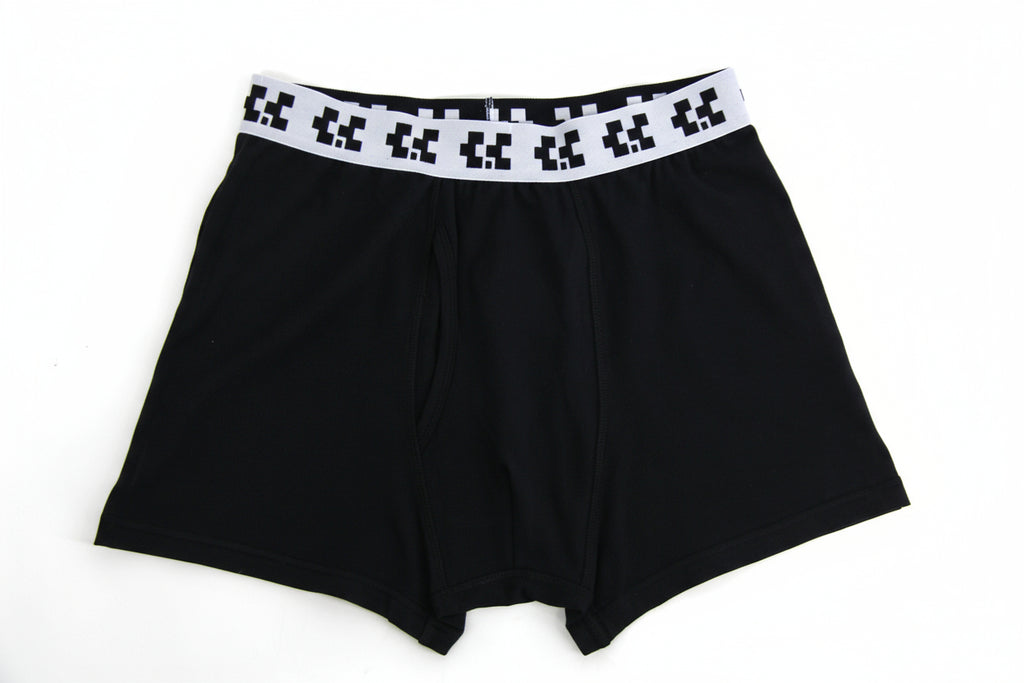 Black boxer briefs with a pixelated waistband on a white background
