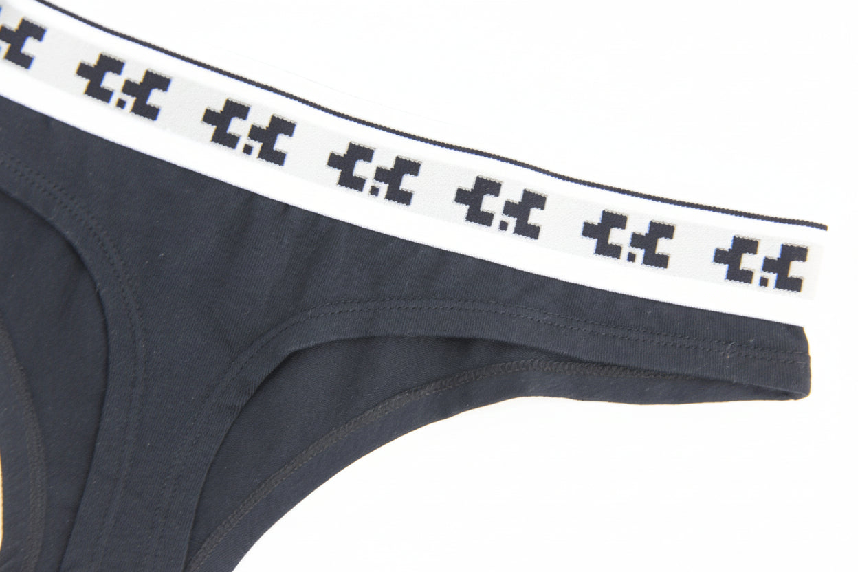 Black underwear with white and black patterned waistband on a white background