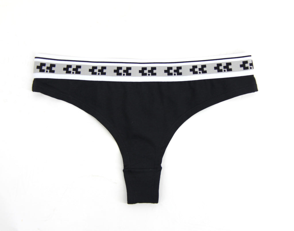 Black thong with a patterned waistband on a white background